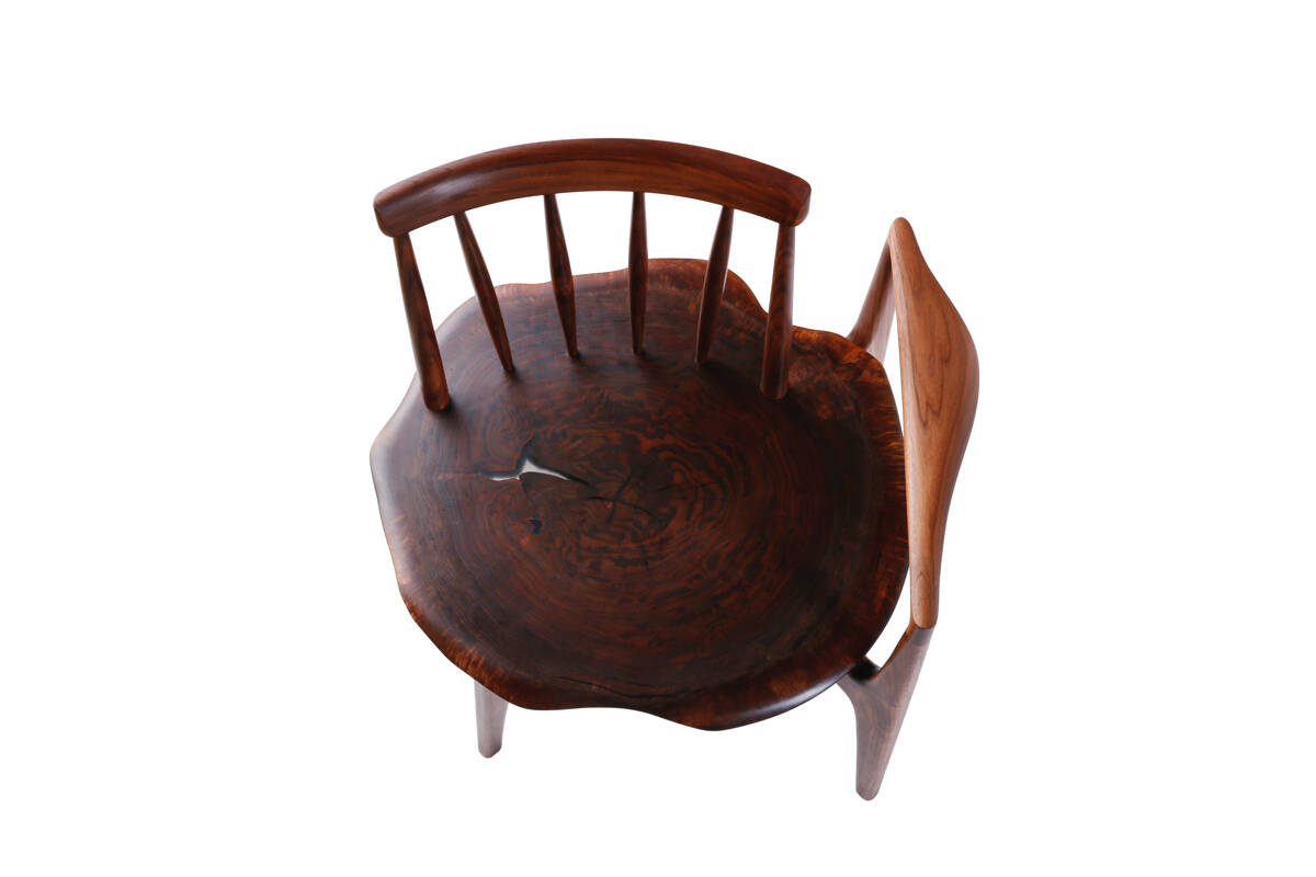 A stump armchair made of a single piece of Claro Walnut